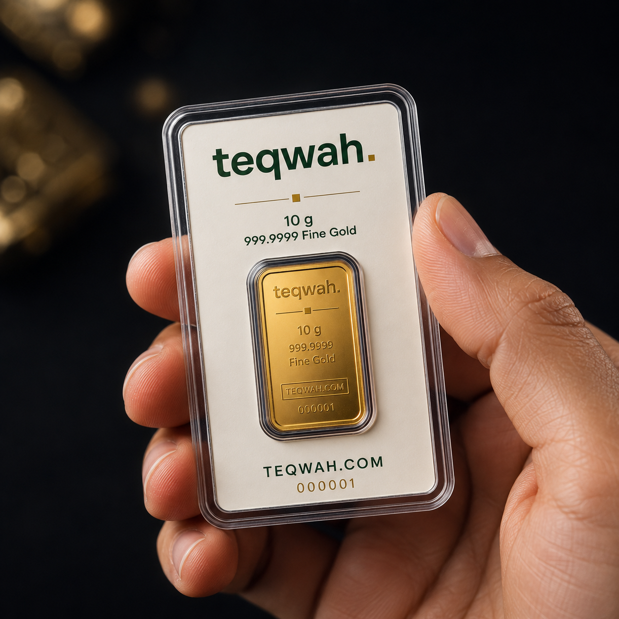 Teqwah 10 gram 999.9999 fine gold bullion bar in a protective sleeve with card insert, held in hand