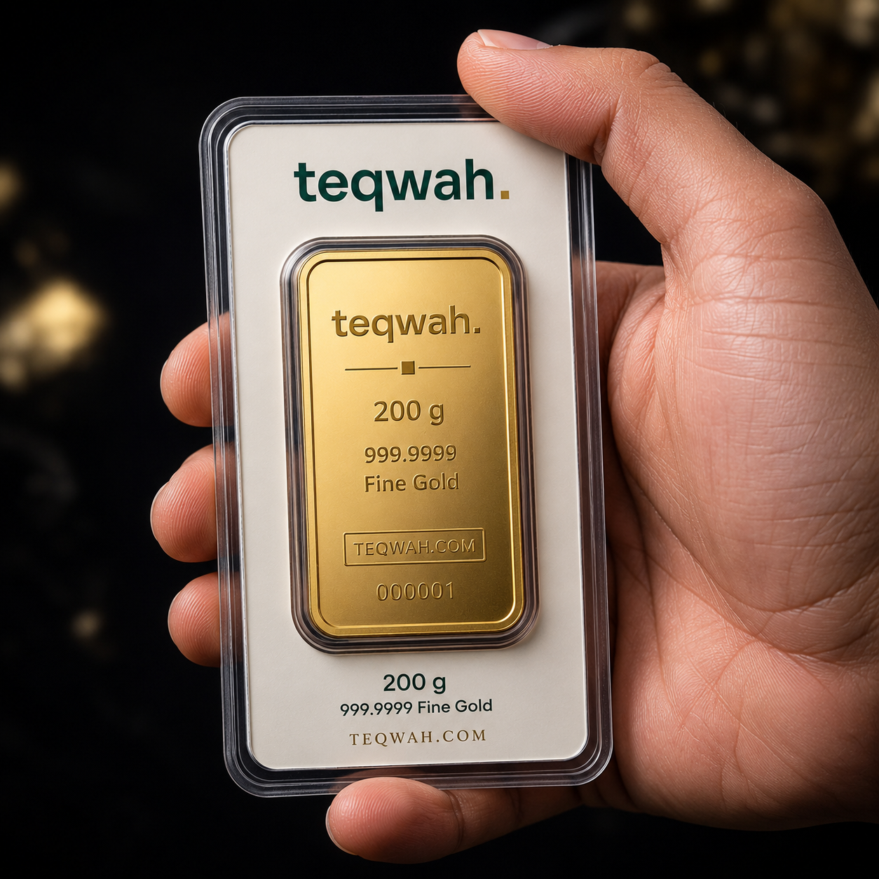 Teqwah 200 gram 999.9999 fine gold bullion bar in a protective sleeve with card insert, held in hand