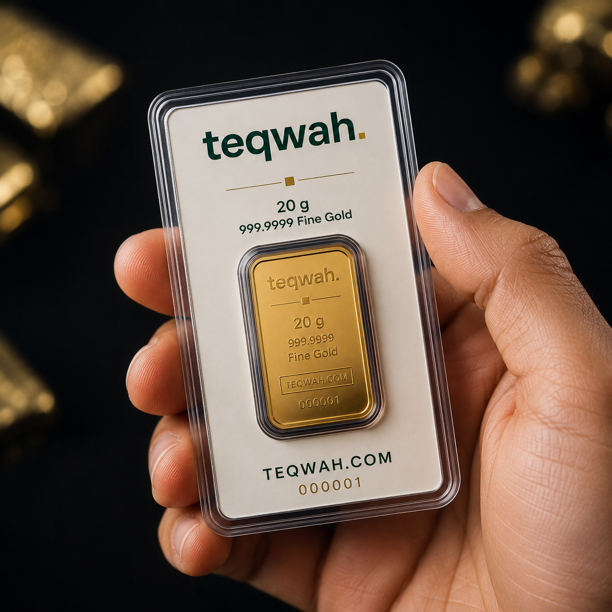 Teqwah 20 gram 999.9999 fine gold bullion bar in a protective sleeve with card insert, held in hand